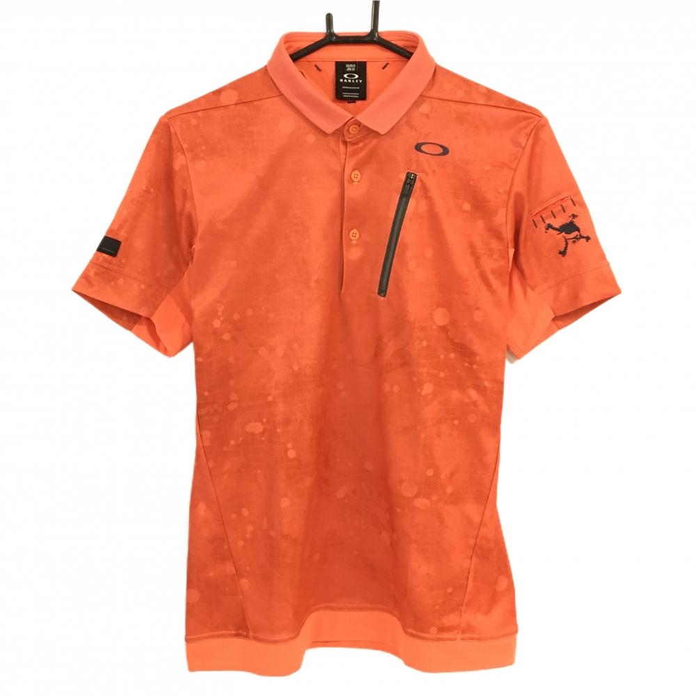 【超美品】オークリー 半袖ポロシャツ オレンジ 総柄地模様 ロゴグレー ティー装着可 メンズ M ゴルフウェア Oakley