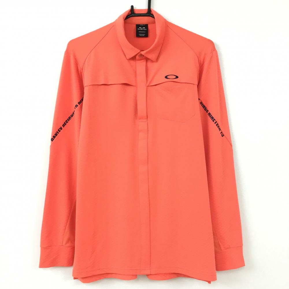 【超美品】Oakley オークリー 長袖ポロシャツ オレンジ×ネイビー 胸ポケット 織生地総柄 メンズ M ゴルフウェア
