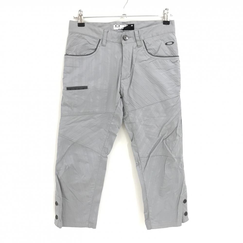 【美品】オークリー 七分丈パンツ グレー 斜めストライプ調 ロゴ刺しゅう 裾ボタン メンズ 30 ゴルフウェア Oakley