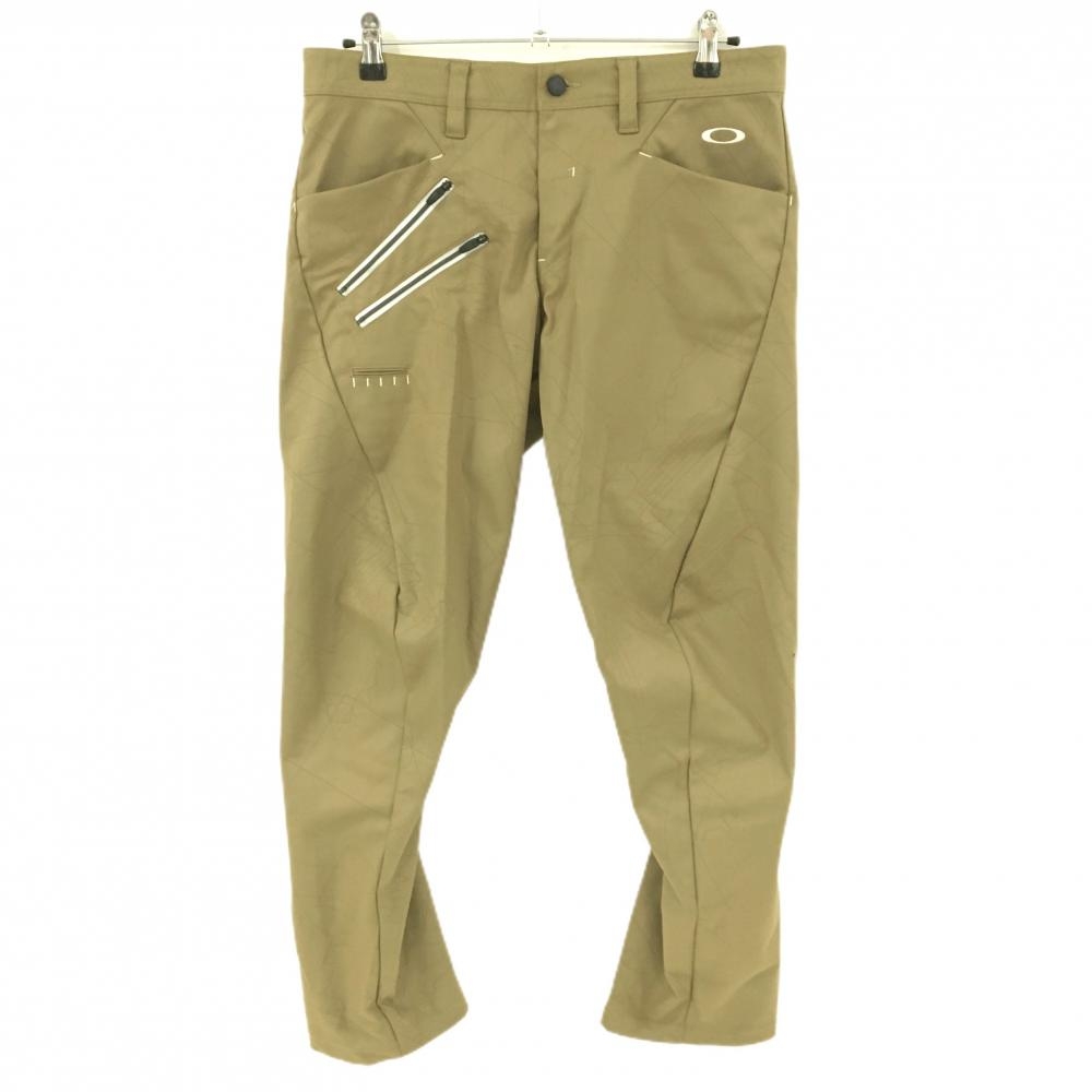 【超美品】オークリー パンツ ベージュ 総柄地模様 ティー装着可 メンズ 34 ゴルフウェア Oakley