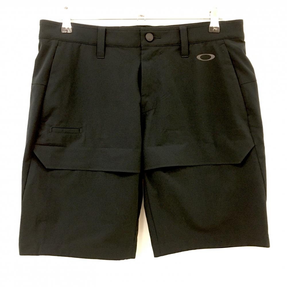 【超美品】オークリー ハーフパンツ 黒系 ロゴプリント ティー装着可 ストレッチ  メンズ 34 ゴルフウェア Oakley