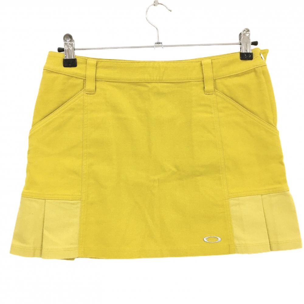 【超美品】オークリー スカート マスタードイエローシルバーロゴ サイドプリーツ  レディース M ゴルフウェア Oakley