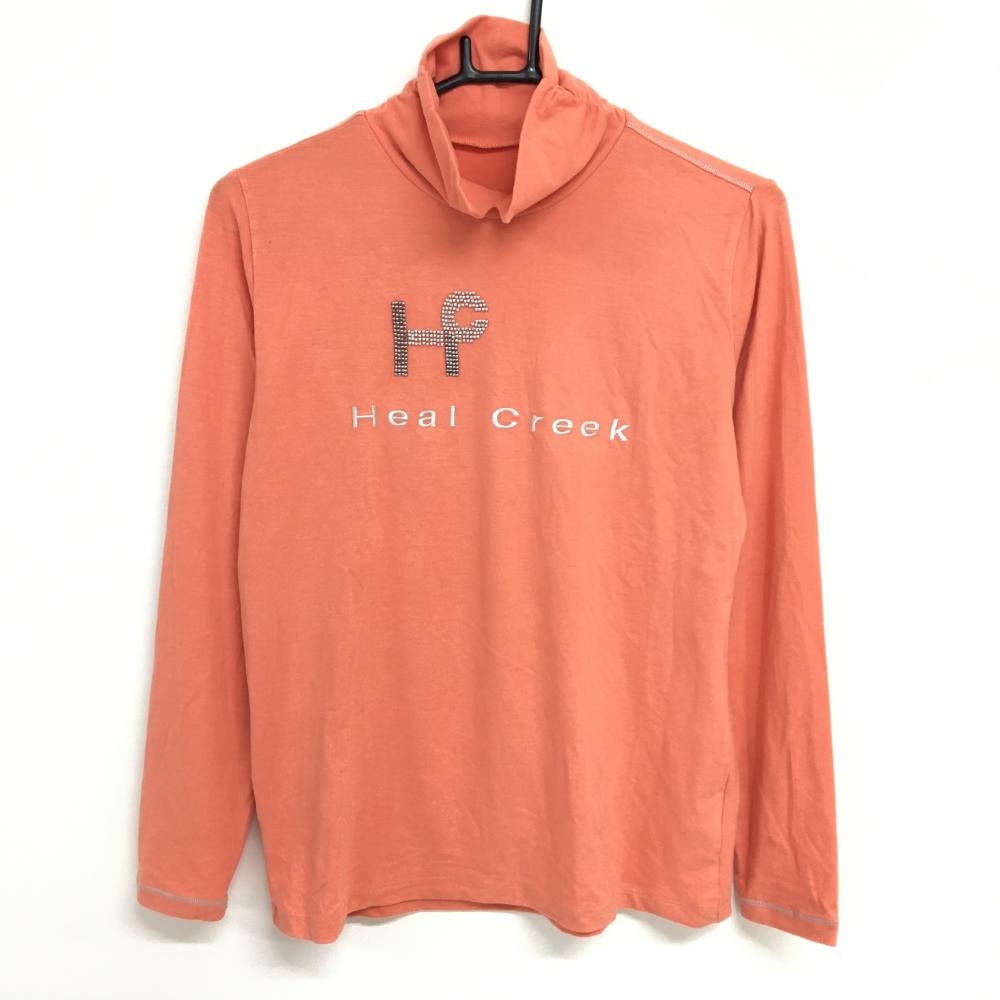 【美品】ヒールクリーク 長袖ハイネックシャツ ライトオレンジ 表微起毛 ストレッチ ビーズロゴ レディース 42(L) ゴルフウェア Heal Creek