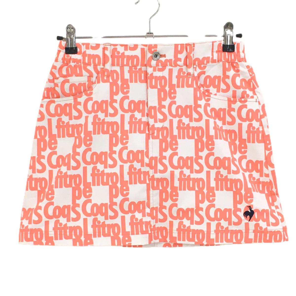 【美品】ルコックゴルフ スカート 白×サーモンオレンジ系 英字総柄 サイドウエストゴム  レディース 9 ゴルフウェア le coq sportif