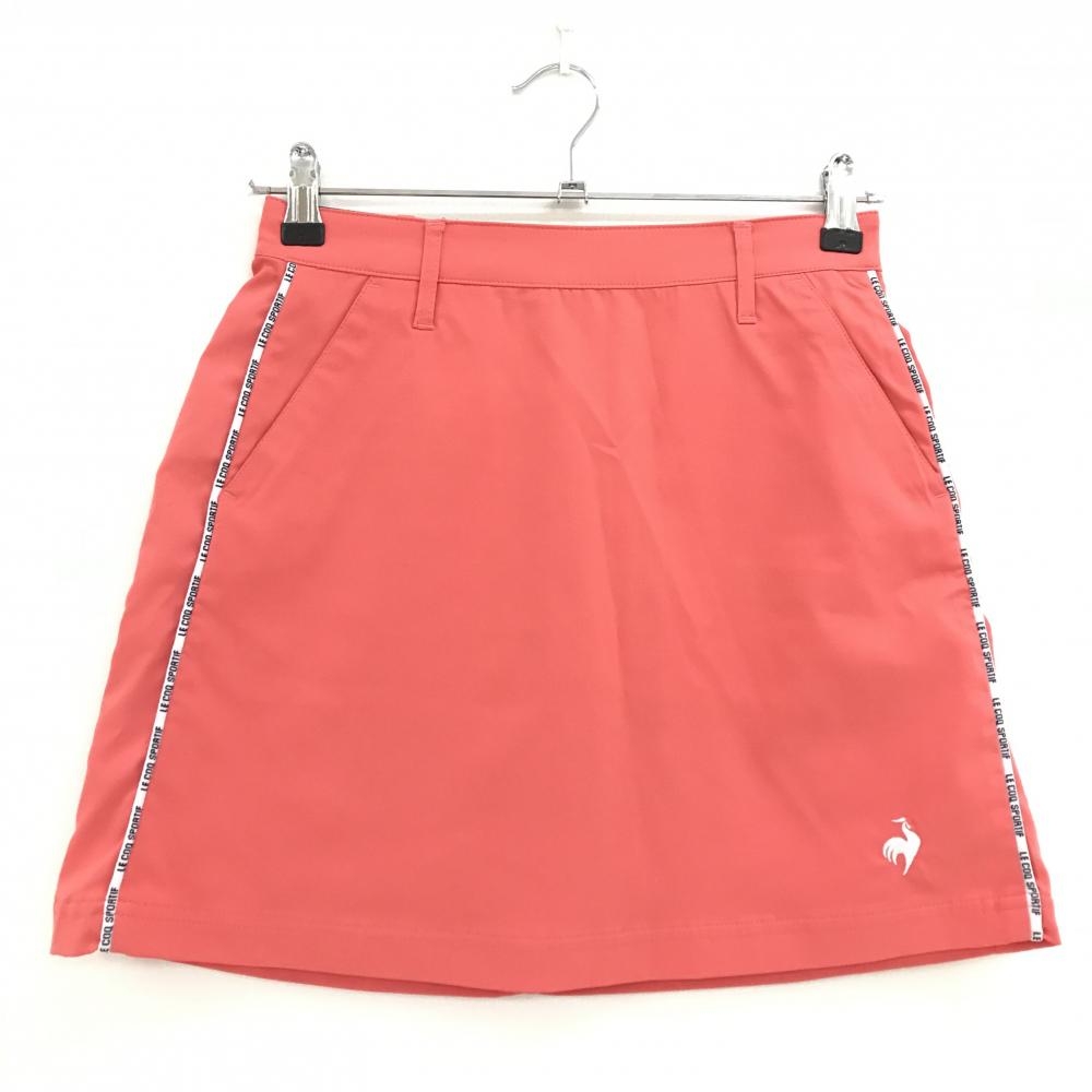 【超美品】ルコックゴルフ スカート サーモンピンク×白 サイドライン ロゴ刺しゅう レディース 7 ゴルフウェア le coq sportif