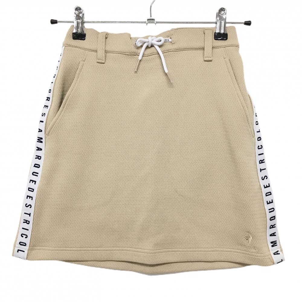 【美品】ルコックゴルフ スカート ベージュ 総柄織生地 サイドライン レディース S ゴルフウェア le coq sportif
