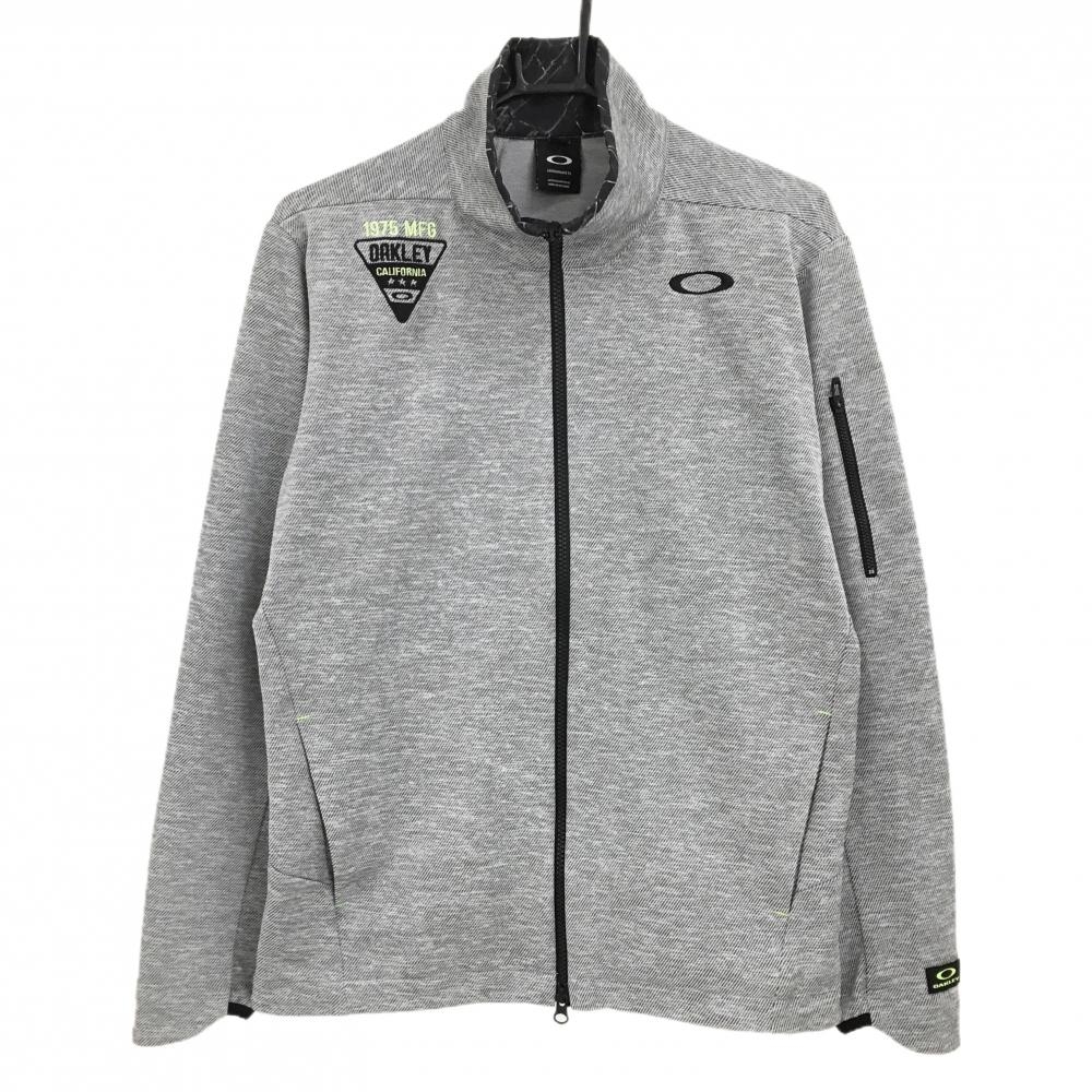 【超美品】オークリー ジャケット グレー×黒 斜めストライプ地模様 ネック内側総柄 ロゴ刺しゅう  メンズ M ゴルフウェア Oakley