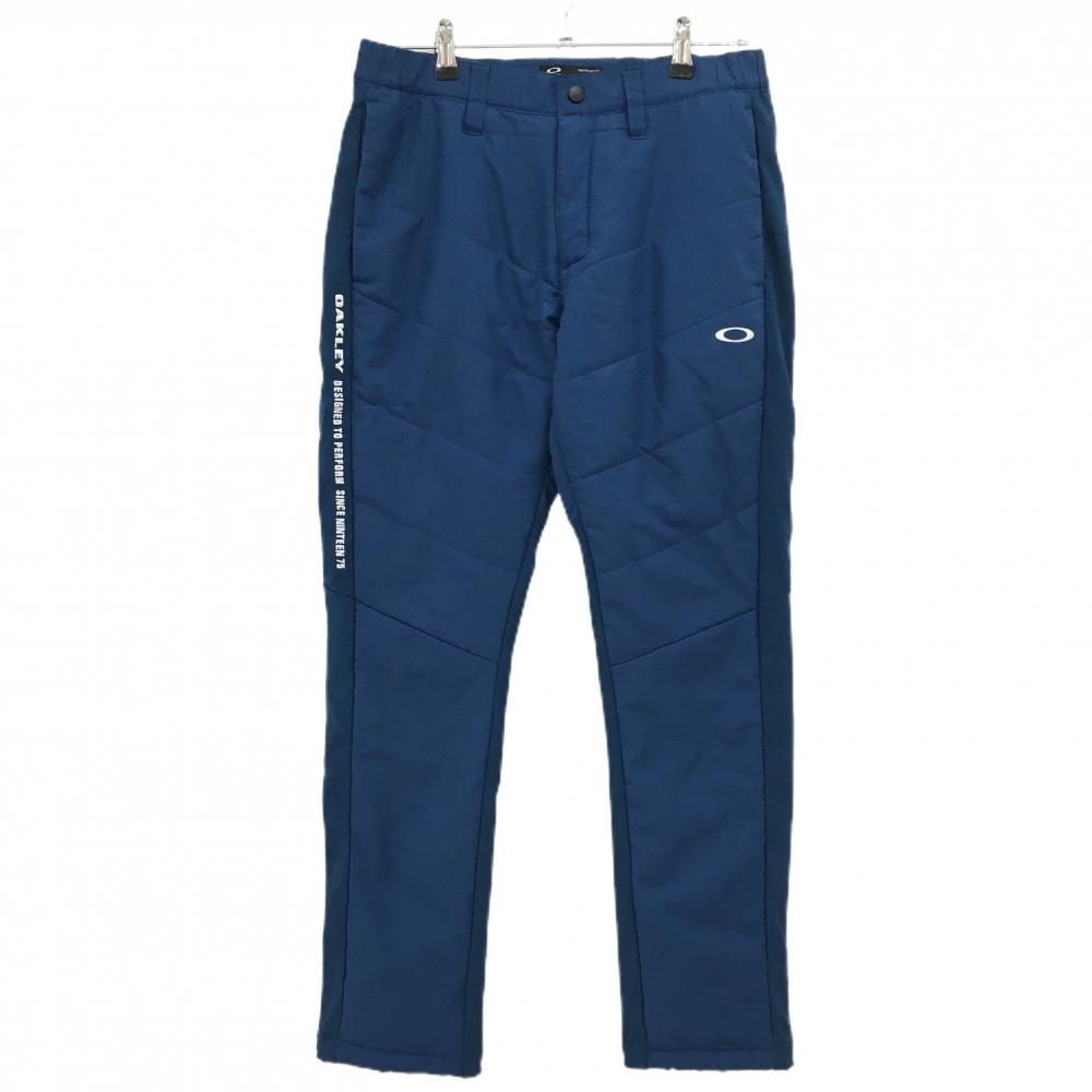【超美品】オークリー 中綿パンツ ブルー 前面・ヒップ中綿 一部蓄熱裏地  メンズ L ゴルフウェア Oakley